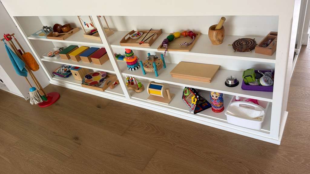 Montessori learning materials on classroom shelves